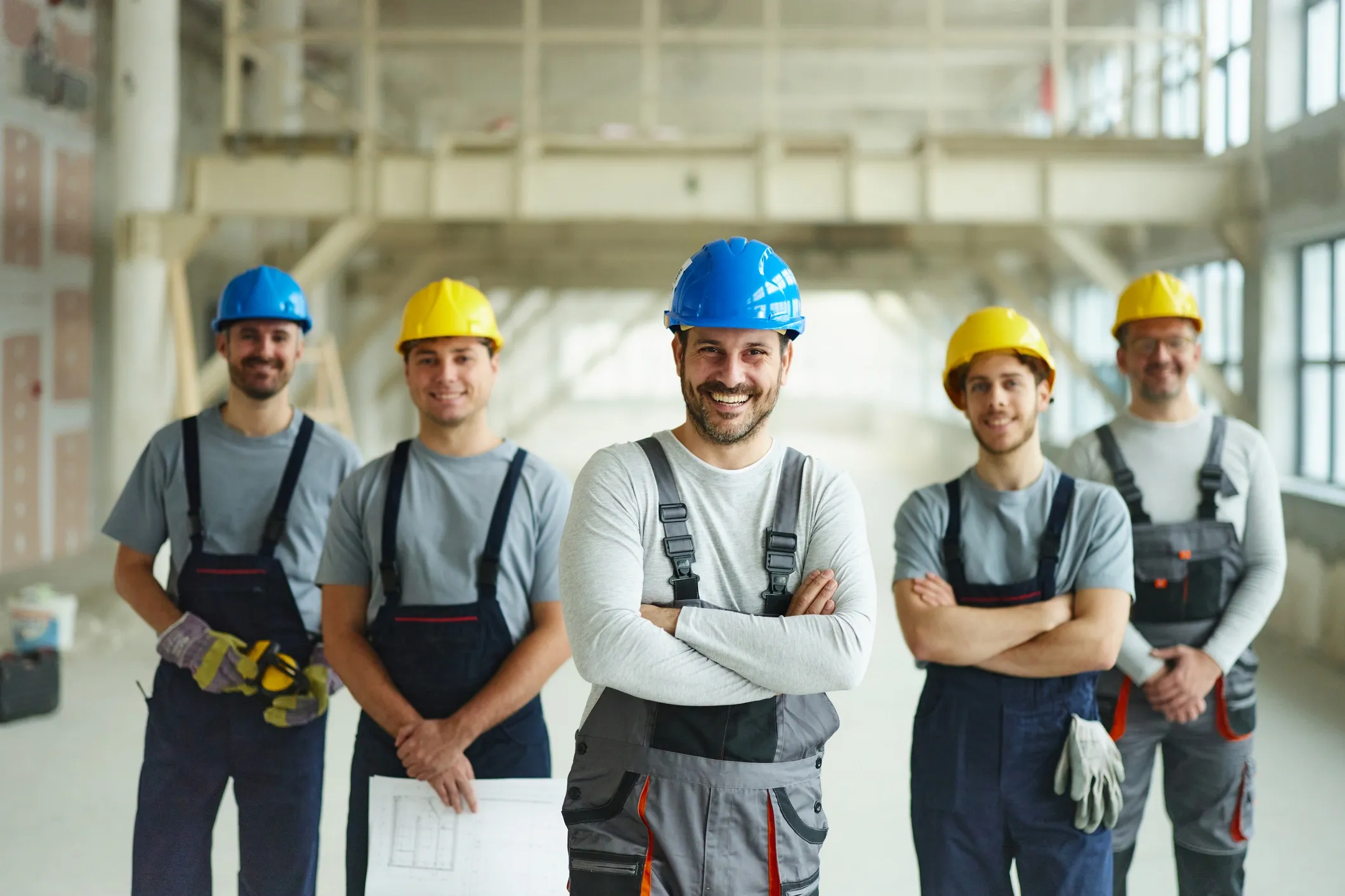 Team of installation professionals in hard hats on site
